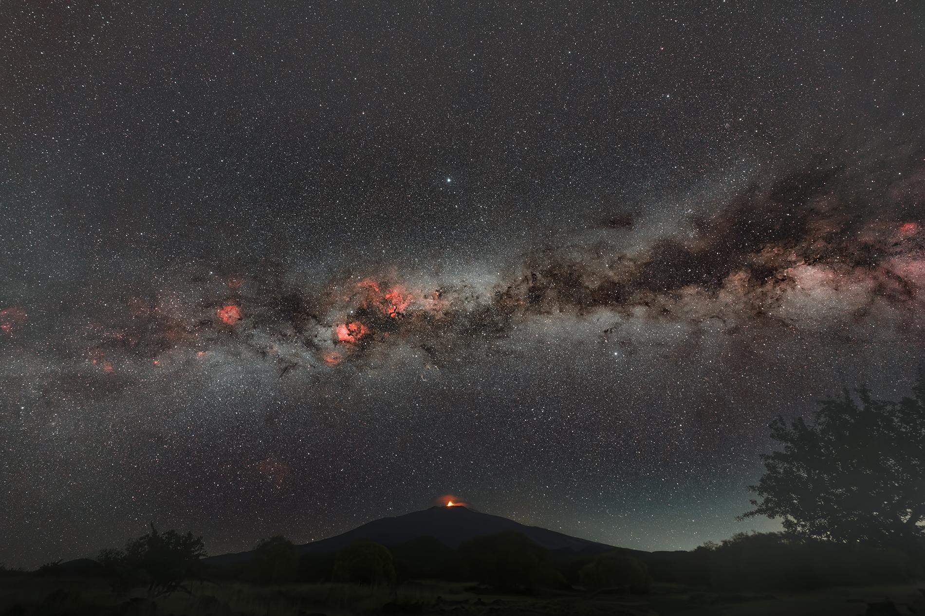 THE SUMMER MILKY WAY OVER ERUPTING ETNA